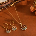 Golden necklace and earring set with blue gemstone whale tail pendant on brown background - Gold Blue Zirconia Round Whale Tail Set (T029)