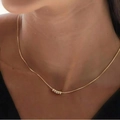 Elegant gold choker necklace with five small cylindrical beads on a fine box chain - KC Gold Necklace (Copper/Five Rings) (1962) / Gold