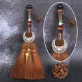 Detail of wooden witch broom pendant with crystal stones and silver crescent charm - Obsidian