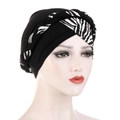 Women's black turban hat with zebra print braided strap shown on model mannequin - Patchwork Black