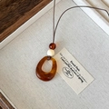 Vintage necklace with brown translucent resin pendant and ivory bead detail - Square Pendant / Amber Brown