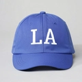 Detailed front view of blue cotton baseball cap with white LA letter embroidery - One Size / Royal Blue