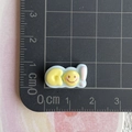 Macro view of small resin alphabet charms with yellow and white smiley and GO! text - GO Mini Word Plate (8)