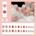 French blush press-on nails with white tips, crystals, and heart details in style Z602 - Z602 Sweet Blush Gradient Style
