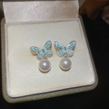 Silver needle earrings featuring light blue butterfly enamel and white pearl drop design - Pale Blue Butterfly Rhinestone Pearl Style (ai-HE24197-9)