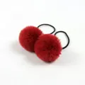 Close-up of fluffy red pom pom hair ties with black elastic bands for kids - Wine Red Pom Pom 5cm