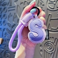 Cute letter S keychain made of light purple leather with woven lanyard and metal ring - Letter S