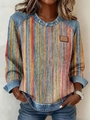 Detail of round neck sweatshirt with multi-color stripes and denim patchwork texture - Rainbow