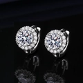 Macro detail of silver halo hoop earrings with shimmering cubic zirconia on black background - Round 1-carat Earrings Led-47