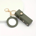 Close-up of green leather lipstick holder and round mirror with gold metal keychain - Army Green