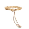 Detailed close-up of a wooden bead bracelet with a cat charm and colorful tassel - Milky Wood + Cat
