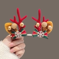 Christmas hair clips featuring red reindeer antlers, gold berries, and green ribbon bows - Snowflake Bow