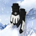 Detail of insulated ski gloves with touchscreen fingertips and windproof adjustable straps - One Size / Men's Black White