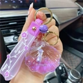 Purple shell keychain with liquid glitter and 'Happy Moments' wrist strap decoration - Purple-Shell Unicorn