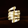Macro shot of multi-layer wide gold rings with polished texture and minimalist wrap design - US 5 / Gold