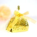 Detail of laser-cut gold wedding favor box in dress shape with a yellow ribbon bow - Reflective Gold