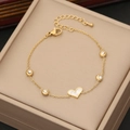 Detail of gold heart charm bracelet with white mother of pearl and zircon stones - White Mother of Pearl Heart