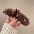 Close-up of plush brown bear hair claw clip with velvet bow and gold metal detail - Dark Coffee