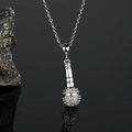 Macro shot of hip hop microphone pendant with sparkling rhinestones on dark rock - Steel Color White Zirconia With Chain