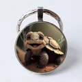 Silver metal keychain with a cute 3D cartoon turtle illustration in a glass cabochon - Cartoon Tortoise/Turtle