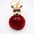Detail of burgundy faux fur pompom keychain with golden french bulldog and bow tie - Burgundy