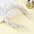 Luxurious white padded headband adorned with various sized pearls for a vintage look - White