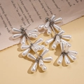 Baroque pearl drop earrings with elegant tassel design on vintage book background - Silver Earring Post-White