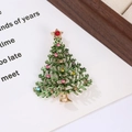 Close-up of a metal Christmas tree brooch featuring colorful rhinestones and a red star - Style 2 (5.7*4cm)