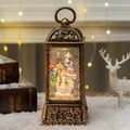 Vintage bronze Christmas lantern with illuminated snowman snow globe and warm yellow light - Snowman Family