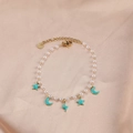 Elegant pearl bracelet with blue enamel star and moon charms on gold stainless steel - Pearl Blue Star Moon