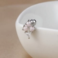 Close-up of pink opal clusters and triangular zircon stud on a white ceramic cup rim - 60065-10 Silver - Triple Gem