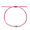 Pink bohemian woven bracelet with evil eye beads and adjustable strap for beach wear - Rose Red