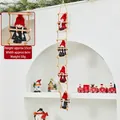 55cm hanging Christmas ladder decoration with five festive red and black knitted figures - Climbing Snowman