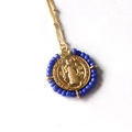 Vintage Virgin Mary pendant necklace with blue bead trim and gold chain for women - Bright Blue