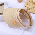 Close-up of woven straw sun hat with orange daisy embroidery and detailed paper texture - 56-58cm / Orange Daisy Hat / Beige