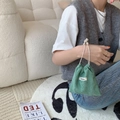 Detail of vintage green corduroy drawstring bag texture held against cozy decor - Grass Green