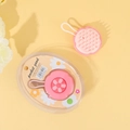 Detailed macro view of pink silicone scalp massager with removable pads for easy cleaning - Pink Flower / PVC Box