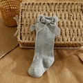 Light grey Spanish style baby knee high socks with a large decorative bow detail - S 0-6 Months / Light Gray