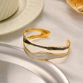 Golden stainless steel open bangle with black and white enamel in a double layer design - Gold Black Grey Mix