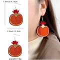Acrylic pomegranate drop earrings for women with detailed size measurements and model look - Pomegranate