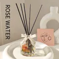 Rose Dew reed diffuser set with faceted glass bottle, dried flowers and black fiber sticks - 100ml / Rose Dew