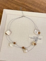 Detail of double-layer necklace featuring irregular shell fragments and amber beads - Coffee Style Z-1304