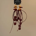 Detail of red tassel drop earrings with dark red beads and golden ear studs on card - Burgundy Ethnic Seed Beads (26#)