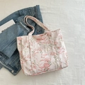Canvas tote bag with pink floral pattern and green leaf design in a soft trendy style - Pink