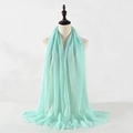 Mint green crinkled cotton linen scarf with soft fringe on an elegant mannequin - Mint Green