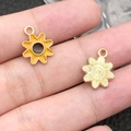 Golden sunflower alloy pendant with orange enamel finish shown on a palm for size - 1Pc Yellow Sunflower 12.5x15.5mm