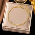 Double-layered gold beaded anklet with crystal pendant on a beige silk jewelry box - JLB5013 Double Layer Single Diamond
