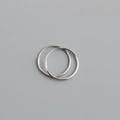 Detailed close-up of a pair of minimalist S925 sterling silver hoop earrings on gray background - 18mm / White Gold