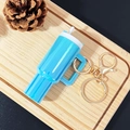 Mini blue Stanley style keychain cup for lipstick holder on a wooden tray decor - Dazzling Sky Blue / Gold Buckle