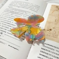 Colorful resin butterfly hair claw clip with vintage lace bow on aesthetic book pages - Dark Candy Color